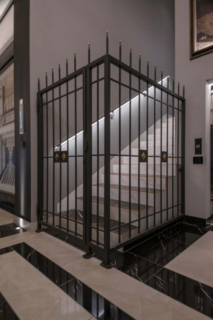 Stair and metal gate at Teatro Romano Suites, Trieste