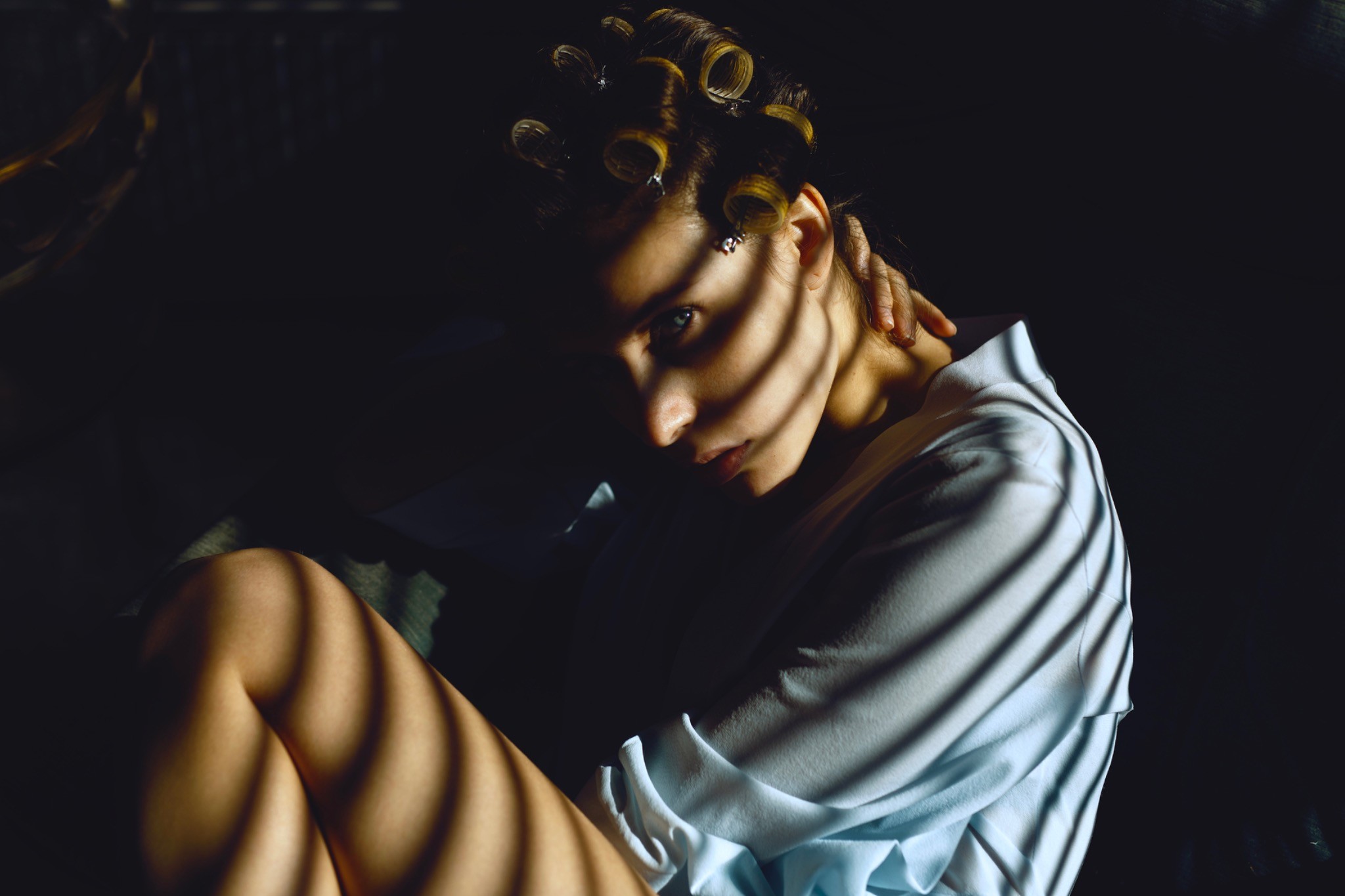 Morning Routine series portrait crossed by graphic window shadows