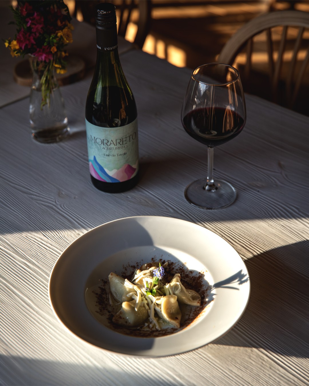 Cjarsons with Morareto wine on the table