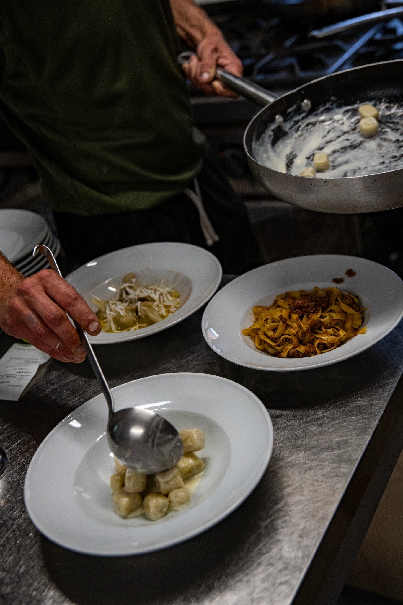 Chef plating dishes in the Morareto kitchen