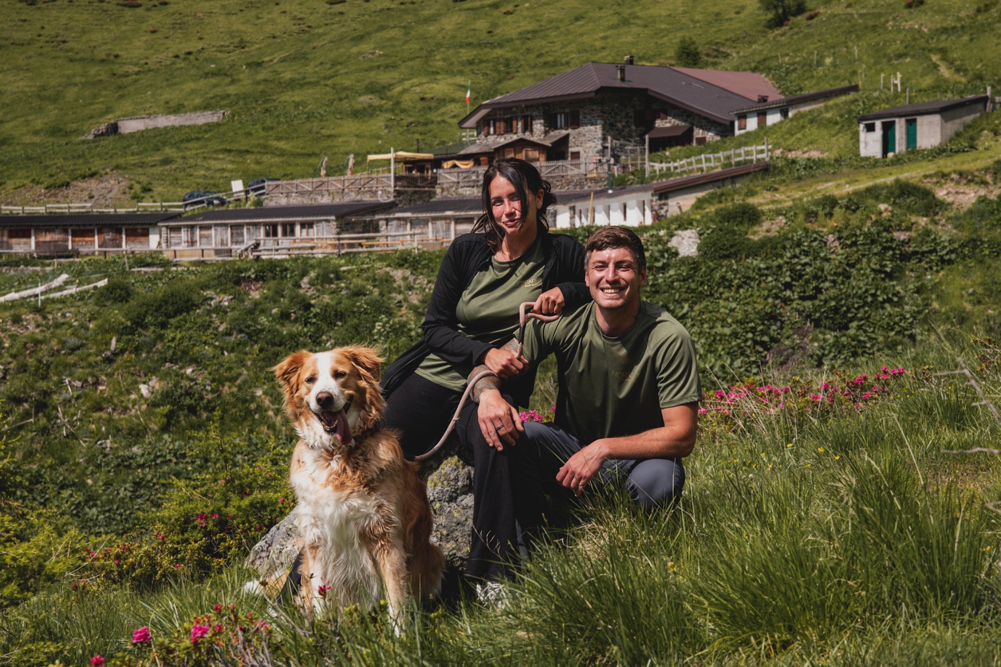 Morareto team members with a dog in the mountain landscape