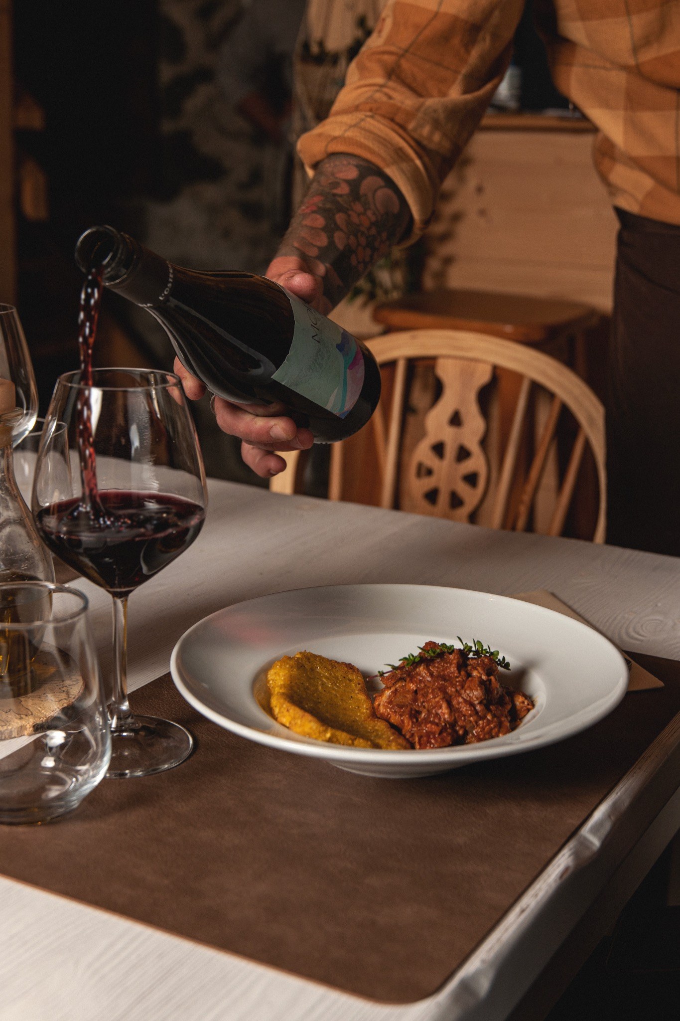 Wine being poured at the table