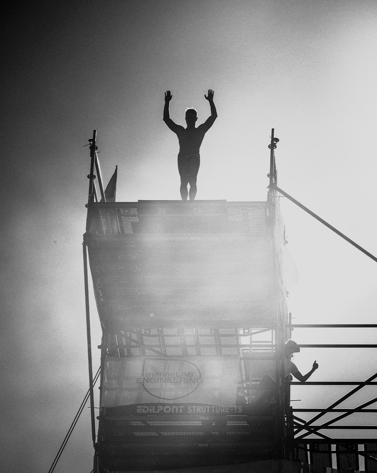Silhouette of an athlete on a diving platform