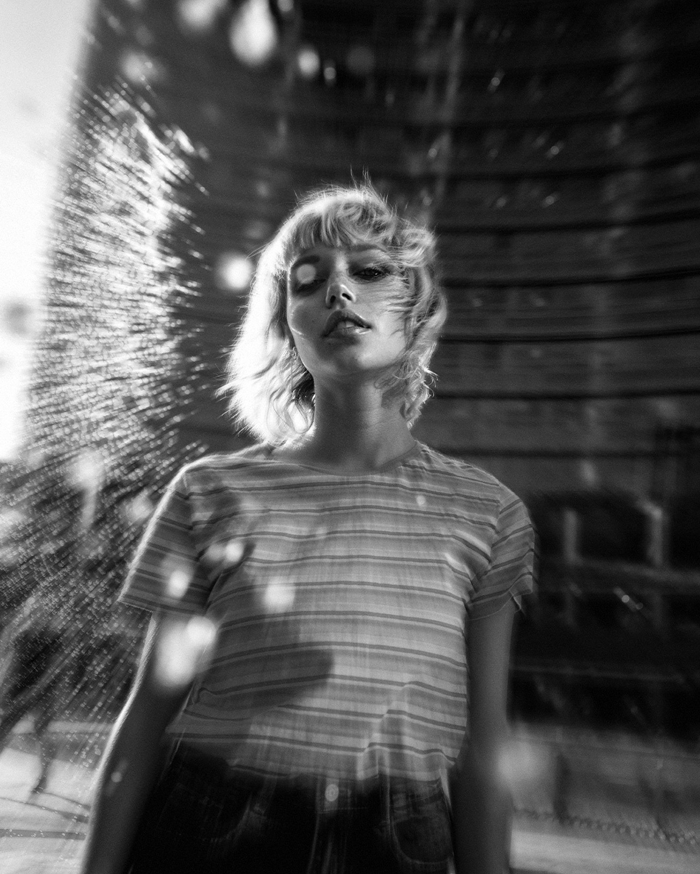 Black and white portrait through reflective glass