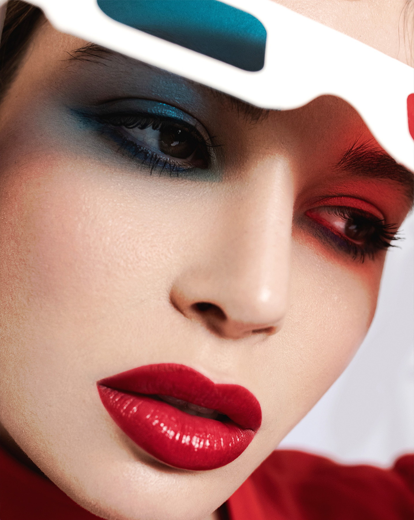 Graphic beauty close-up with red and blue makeup