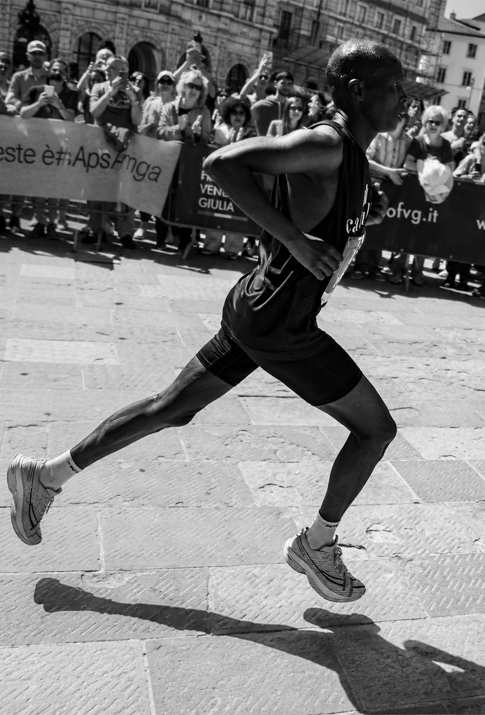 Runner in black and white with a long shadow