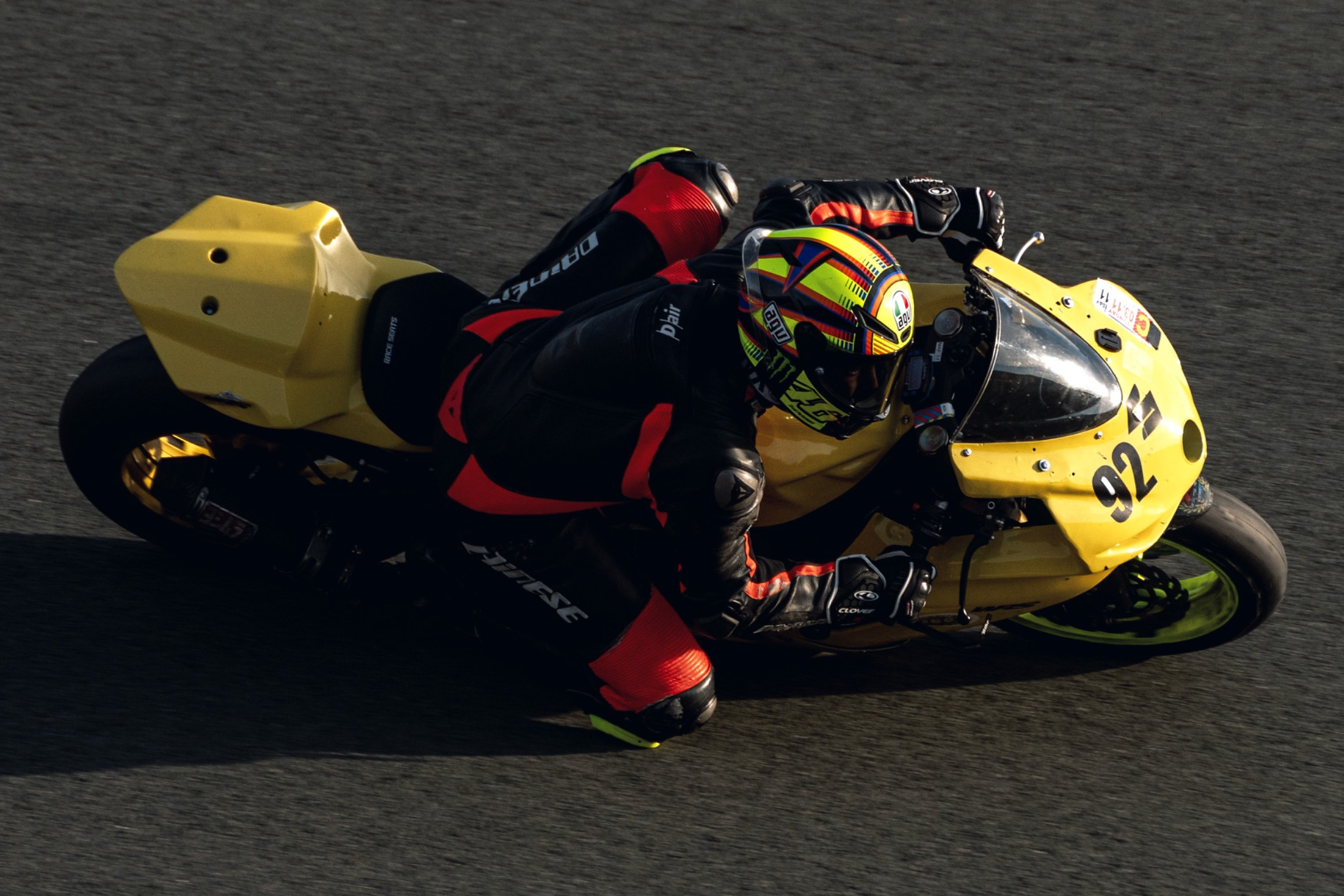 Motorcycle racer leaning into a corner